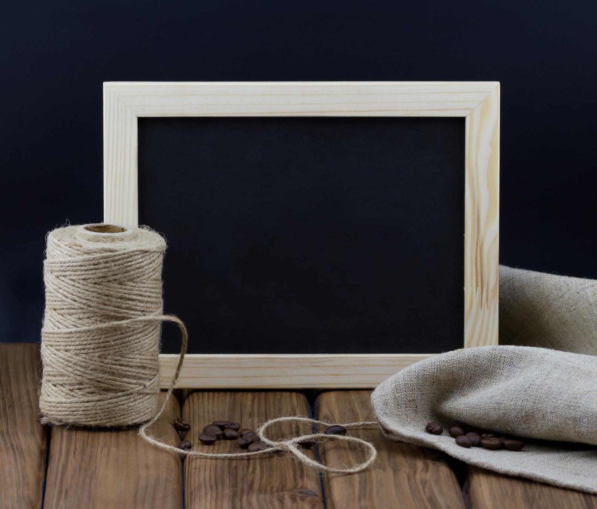 Studio workspace with embroidery frame and threads
